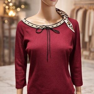 Used AnnTaylor blouse size M.burgundy color cream,black polka-dot neckline.